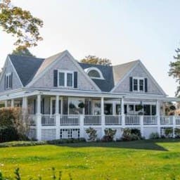 After: white house with a freshly mowed lawn